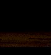 a dark background with a purple light coming out of it .