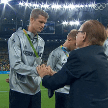 a man wearing a silver jacket with the word germany on it