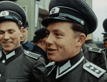 a man in a military uniform has a badge on his shoulder that says ' a '