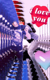 a man taking a picture of himself with a red heart that says i love you