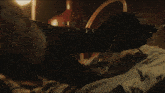 a person wearing a pair of black gloves is laying down