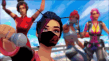 a woman wearing a mask is taking a selfie with a group of women .