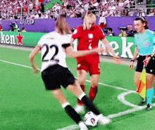 a soccer player with the number 22 on her jersey kicks the ball