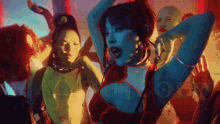 a woman in a red top is surrounded by a group of people