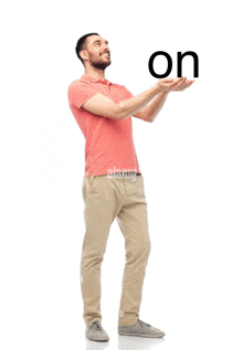 a man holds up the word on in his hands