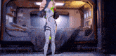 a woman in a futuristic suit is standing in a room