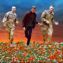 a painting of three soldiers walking on a pile of pumpkins