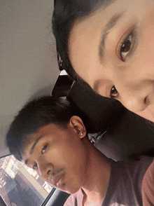 a man and a woman are sitting in a car