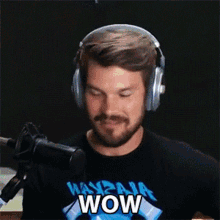 a man wearing headphones and a t-shirt that says wow