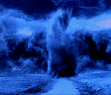 a waterfall is erupting in the middle of a dark blue cloudy sky