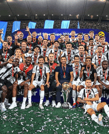 a group of soccer players posing for a picture with a trophy that says besiktas