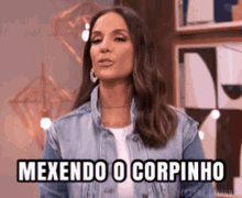 a woman in a denim jacket says mexendo o corpinho .