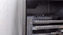 a stainless steel oven with the words made in animotica above it