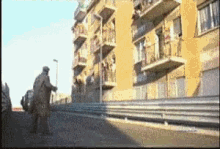 a blurry picture of a building with balconies
