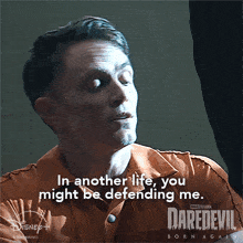 a poster for daredevil born again shows a man in a jail cell