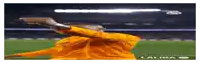 a soccer player in a yellow jersey is pointing at the camera