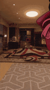 a living room with a rug that has a geometric pattern on it
