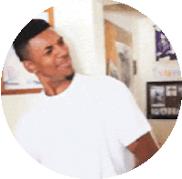 a man in a white t-shirt is standing in a circle .