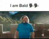 a man with a beard is standing in front of a mountain with the words i am bald below him