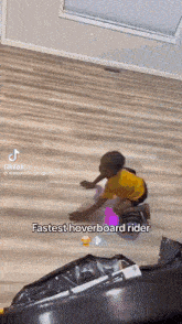 a young boy is riding a hoverboard on the floor .