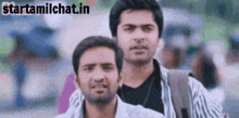 a couple of men standing next to each other with the words starttamilchat.in in the corner