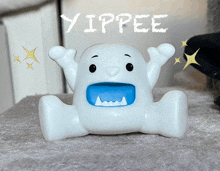 a white ghost with a blue mouth and the word yippee on the bottom