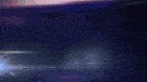 a blurred image of a car with purple lights