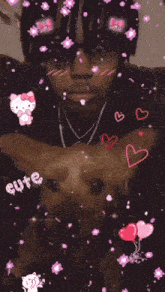 a man with dreadlocks is holding a dog with hearts and hello kitty stickers on his face .