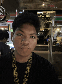 a man with a lanyard around his neck that says ' aeeec '