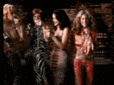 a group of women are having a party and drinking cocktails .