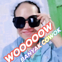 a woman wearing sunglasses has the words wooooow banyak cowok written on her face