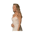 a woman in a white lace dress stands with her hands on her hips