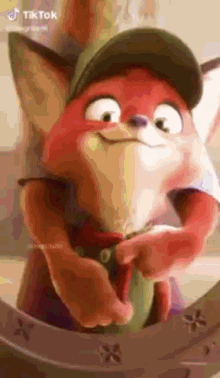 a close up of a cartoon fox wearing a hat and holding a sword .