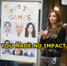 a woman is standing in front of a jimmy jab games sign