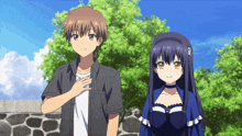 a boy and a girl are standing next to each other in a park