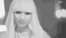a black and white photo of a woman with a mtv logo