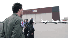 a man in a military uniform has a patch on his back that says us air force