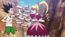 a girl in a pink dress is fighting a boy in a white tank top and green shorts