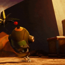 a green robot with a red button on its head