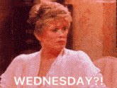 a woman in a white shirt says wednesday ?