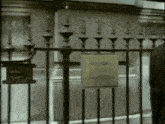 a metal fence with a sign on it that says ' closed ' on it