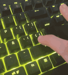 a person is typing on a keyboard with the enter key visible