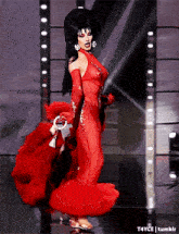 a woman in a red dress and gloves is dancing on a stage with t4yce tumblr in the corner