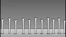 a row of bones with hearts on them are lined up in a row