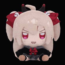a stuffed animal with horns and skulls on its head