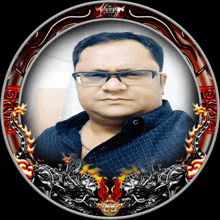 a man wearing glasses and a blue shirt is in a circle with flames around him