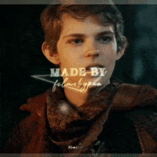 a young man wearing a scarf and a jacket with the words made by filmsbypan written on the bottom
