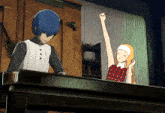 a man and a woman are standing next to each other with the woman raising her fist in the air