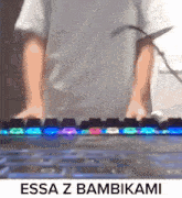a person is typing on a keyboard with the words " essa z bambikami " below them