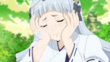 a girl with a bandage on her arm is crying